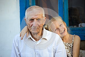 Granddaughter embracing with grand parents