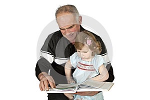 Granddaughter grandfather reading a book