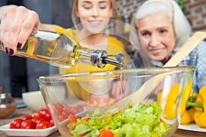 Granddaughter and grandmother cooking together