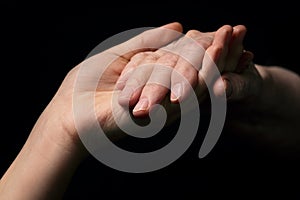 Granddaughter and grandmother holding hands