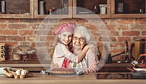 Granddaughter hug her happy grandmother