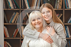 Granddaughter taking care of her retired grandmother hugging