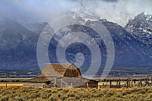 Grandeur of Teton Mountain peaks are background for Moulton barn at Mormon Row