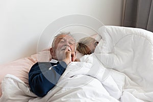 Grandfather ask to keep silence while grandmother is going to sleep