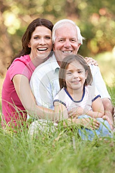 Grandfather, Daughter And Granddaughter In Park