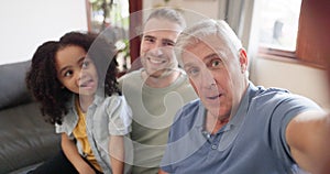 Grandfather, father and child take a funny selfie as a crazy family in home and bonding together for love. Crazy, goofy