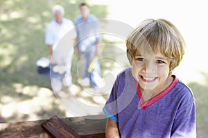 Grandfather, Father And Son Building Tree House Together