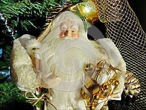 Grandfather Frost Santa Claus, St. Nicholas, Joulupukki with gifts on the against the Christmas tree. Symbol of New year