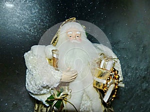 Grandfather Frost Santa Claus, St. Nicholas, Joulupukki with gifts on the background of the night frosty starry sky.