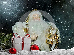 Grandfather Frost Santa Claus, St. Nicholas, Joulupukki with gifts on the background of the night frosty starry sky.