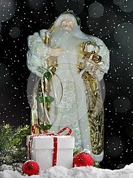 Grandfather Frost Santa Claus, St. Nicholas, Joulupukki with gifts on the background of the snowy night. Symbol of New year