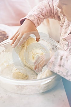 Grandfather and granddaughter sifted flour