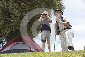 Grandfather And Grandson Bird Watching