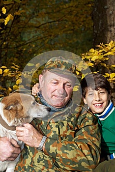 Grandfather, grandson and dog