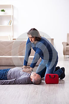 Grandfather and grandson in first aid concept