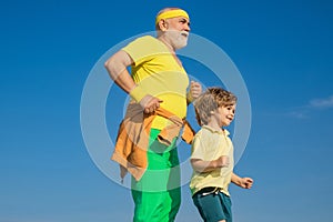 Grandfather and grandson, old and young healthcare cheerful lifestyle. Funny sporty old sportsman and cute little child