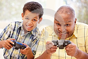 Grandfather and grandson playing computer games