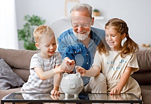 Grandfather helping grandchildren to save money