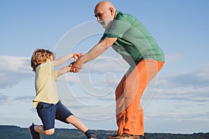 Grandfather helping hand. Child rearing. The educative process needs to begin early in a childs life. Often the childs