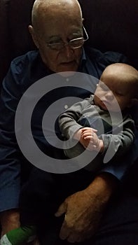 Grandfather holding Baby