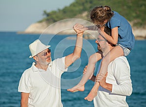 Grandfather holding girl s hand