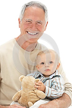 Grandfather Holding Grandson With Teddy Bear