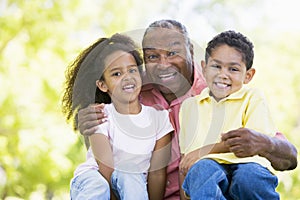 Grandfather laughing with grandchildren photo