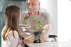 Grandfather looking at his granddaughter