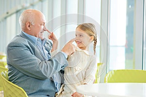 Grandfather meeting his cute granddaughter.