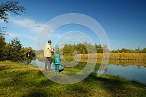 Grandfather and nephew fishing photo