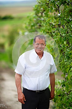 Grandfather outdoor in orchard
