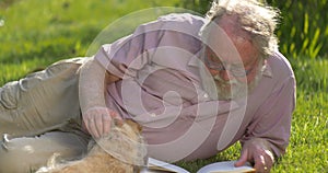 Grandfather retired elderly mature senior adult male in 60s retirement with dog