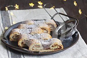 Grandfather's mustache cookies made from shortcrust pastry filled with nuts, jam and cocoa, Christmas toys and