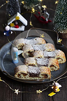 Grandfather's mustache cookies made from shortcrust pastry filled with nuts, jam and cocoa, Christmas toys and