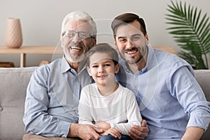 Grandfather son and grandson multi generational family portrait photo