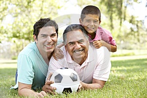 Grandfather With Son And Grandson In Park