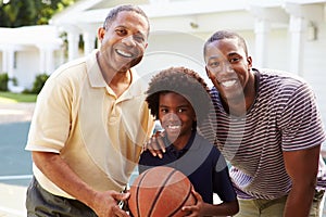 Grandfather With Son And Grandson Playing Basketball photo