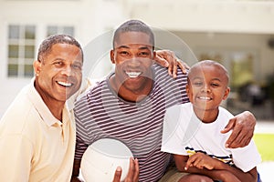 Grandfather With Son And Grandson Playing Volleyball