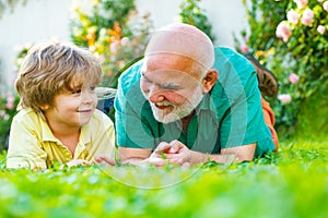 Grandfather with son in park. Grandfather and grandson Playing - Family Time Together. Father and grandfather. Happy