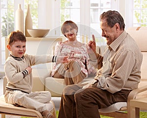 Grandfather telling telling a story to grandson