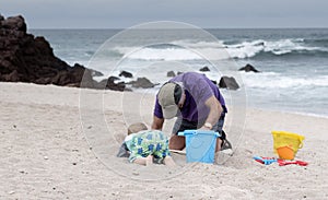 Grandfather & Toddler Grandson Play on the Beach in Mexico