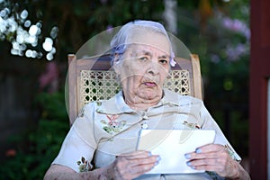 Grandma checking tablet