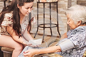 Grandma doing a check-up on the health at home.