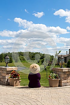 Grandma gardener taking a break to admire the view