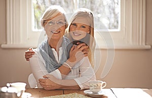 Grandma, grandchild and happiness with hug in portrait at nursing home for visit and conversation with love. Mature