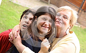 Grandma with grandchildren close up cuddle photo