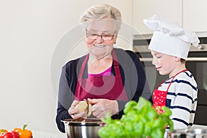 Grandma and grandson cooking together