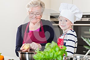 Grandma and grandson cooking together