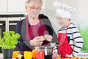 Grandma and grandson cooking together