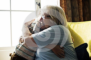 Grandma and grandson hugging together